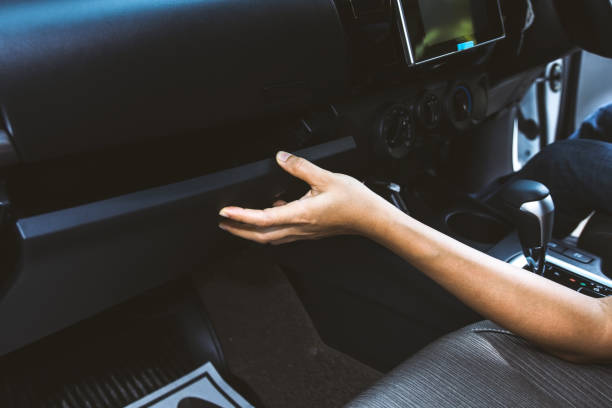 Young woman open glove compartment in car scene Young woman using and open glove compartment in car glove box stock pictures, royalty-free photos & images