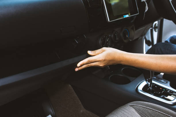 Close up hand opening glove compartmet in car Woman hand opening glove compartment front panel in car glove box stock pictures, royalty-free photos & images