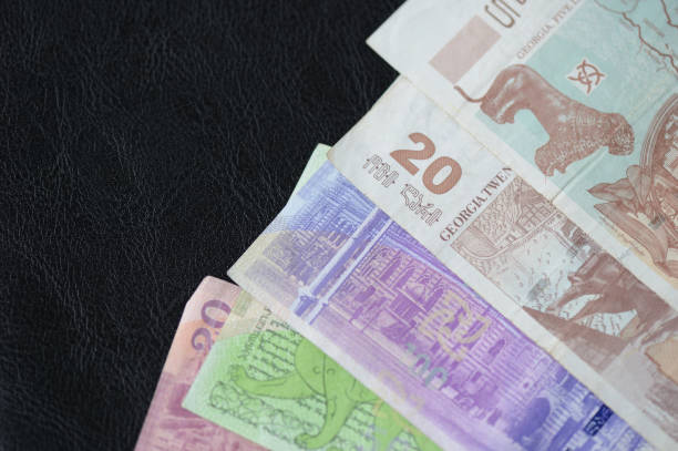 istock Some banknotes of Georgian lari on a dark background 848574708