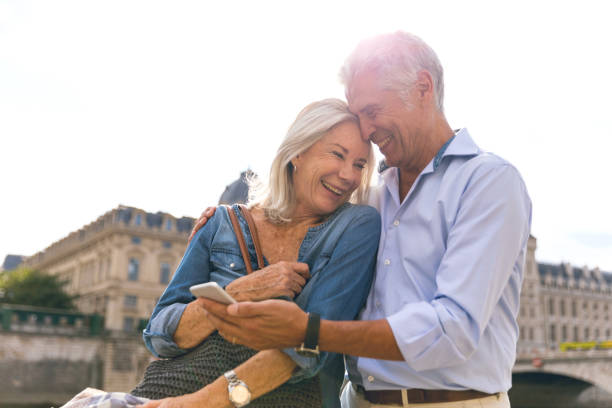 istock Seniors taking a break in Paris relaxing on the Seine River 848588254