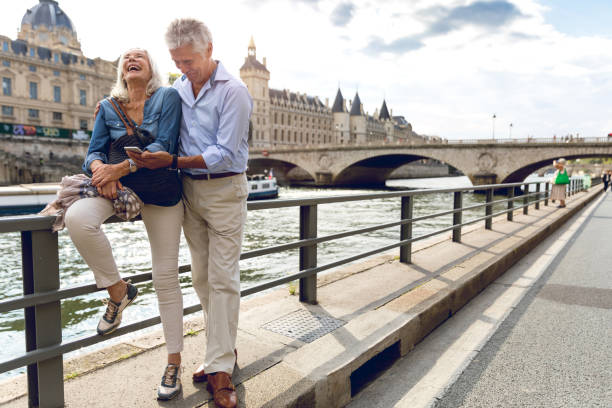 istock Seniors taking a break in Paris relaxing on the Seine River 848588322