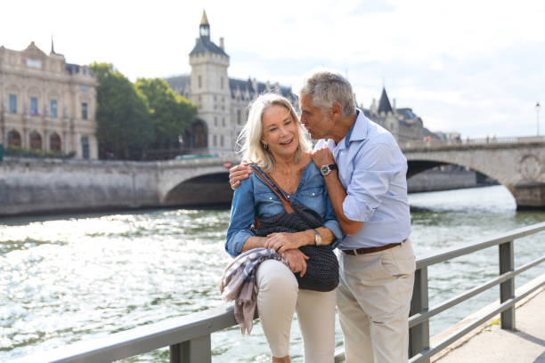 istock Seniors taking a break in Paris relaxing on the Seine River 848588336