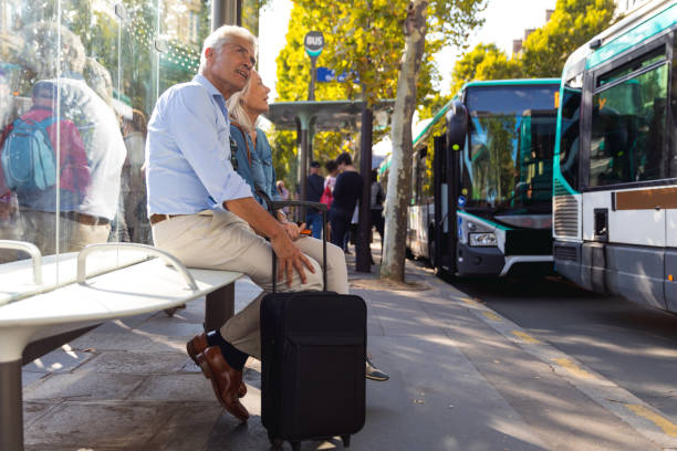 Seniors at bus stop waiting to get to the airport