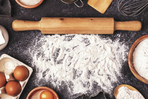 istock Ingredients for baking  - flour, wooden spoon, rolling pin, eggs. 848591812