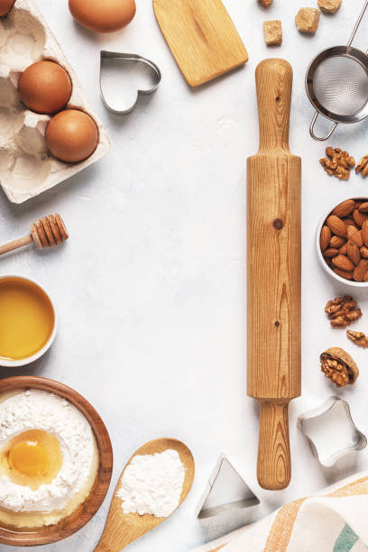 istock Ingredients for baking  - flour, wooden spoon, rolling pin, eggs. 848595778