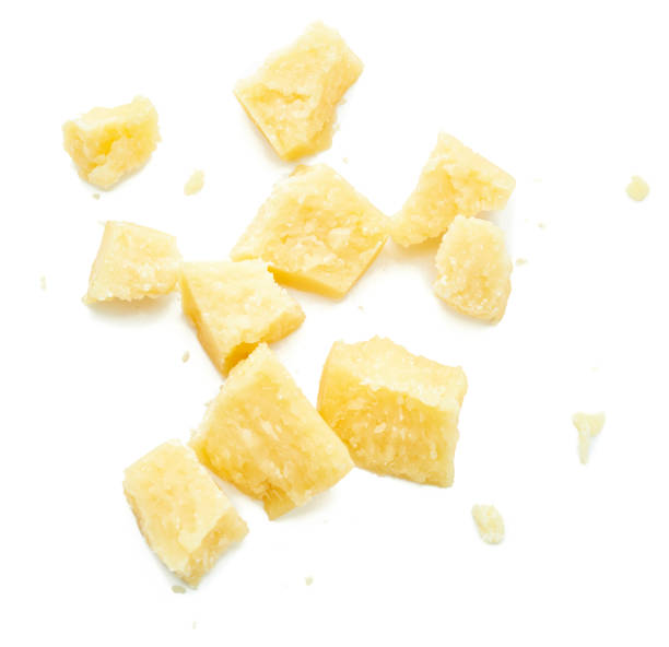istock Parmesan cheese pieces on white background. Italian cheese slices. Top view. 848602878