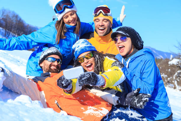 istock Group of young skiers making selfie on snow mountain 848624522