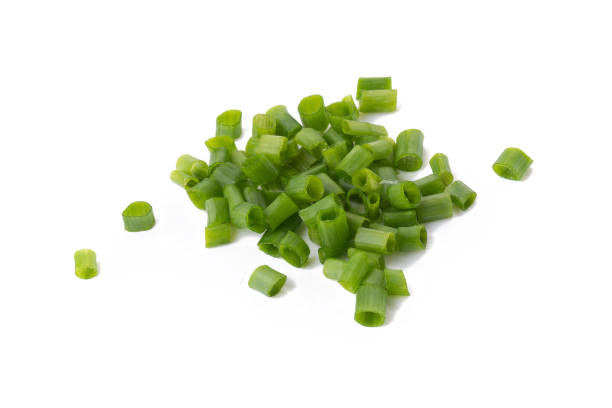 istock Chopped fresh green onions isolated on white background 848624784