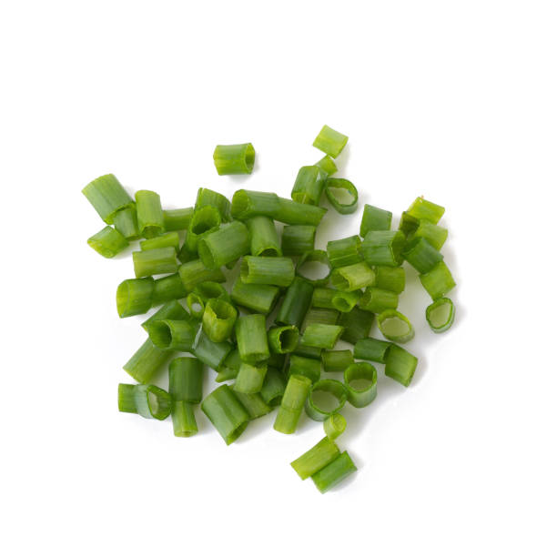 istock Chopped fresh green onions isolated on white background 848624806