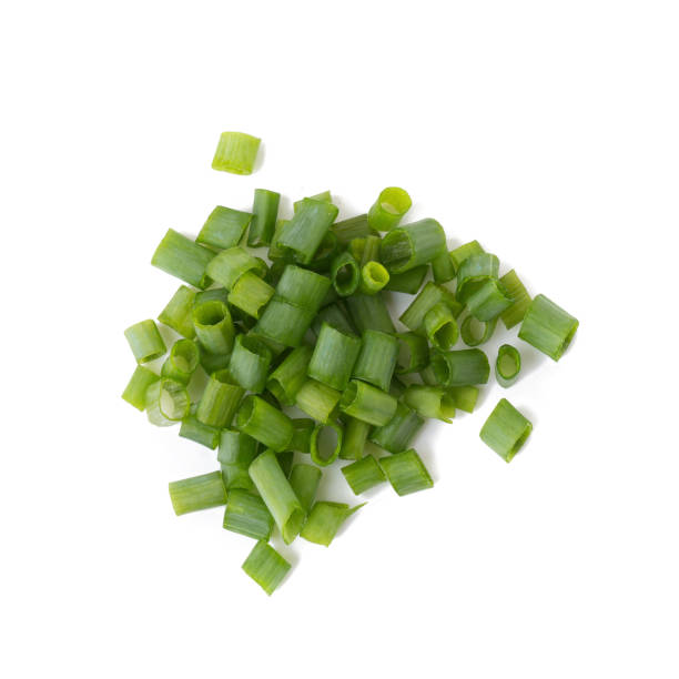 istock Chopped fresh green onions isolated on white background 848624810