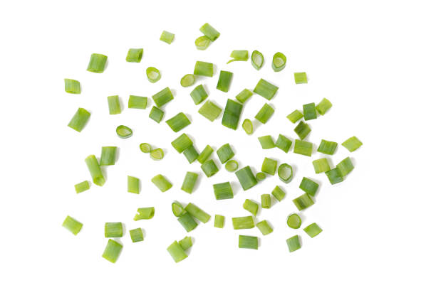 istock Chopped fresh green onions isolated on white background 848624826
