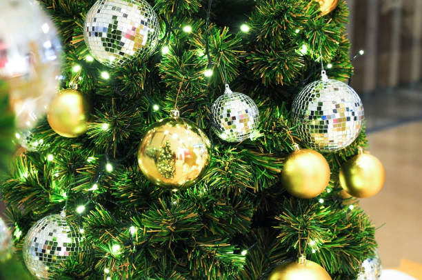 istock christmas tree with ball gold decoration 848631706