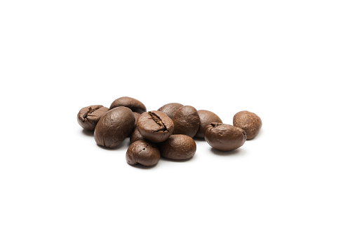 Coffee beans closeup side view on white background