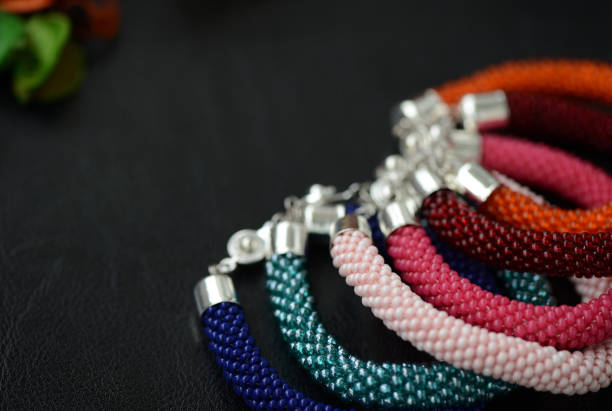 istock Bead crochet bracelets different colors on a dark background 848638130