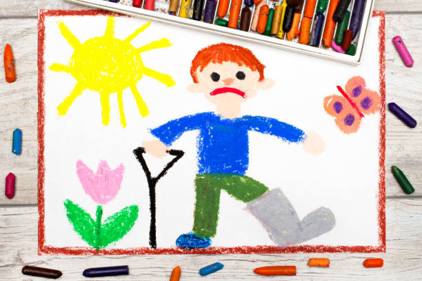 istock Photo of colorful drawing: Sad boy with broken leg 848638310