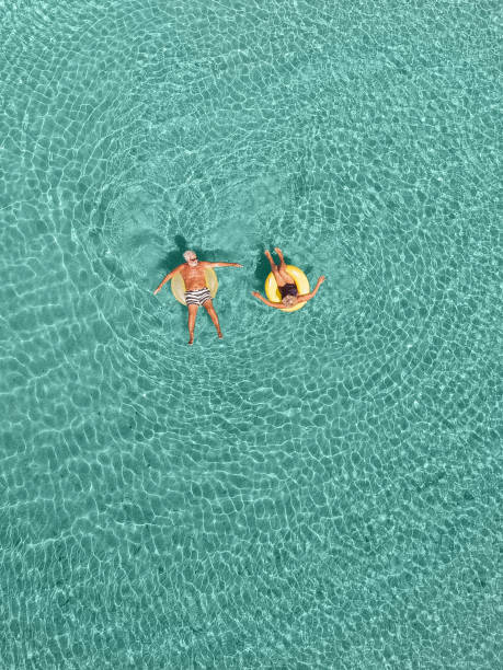 istock Senior couple enjoy sea water 848645816