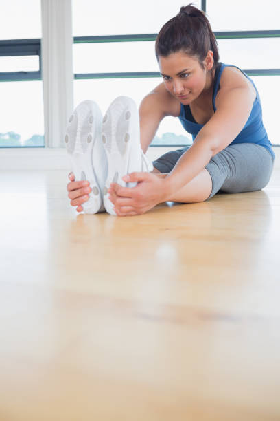istock Woman stretching in yoga pose 848648360