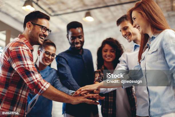 Young People Showing Team Spirit Focus On Hands Stock Photo - Download Image Now - Teamwork, Togetherness, Group Of People
