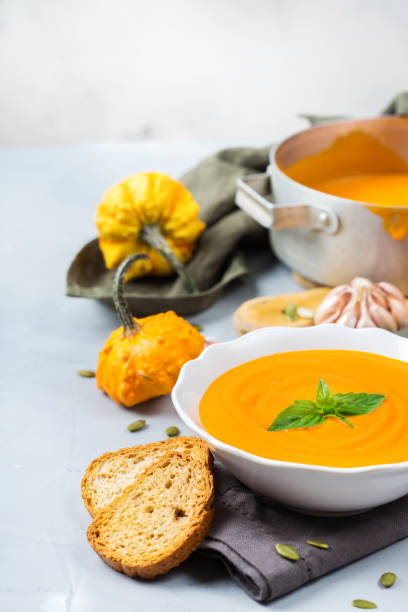 istock Fall autumn roasted orange pumpkin carrot soup with garlic 848653626