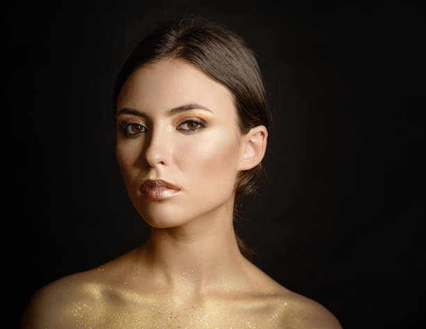 istock Woman with golden makeup. 848661154