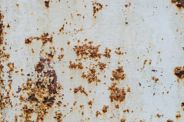 istock Old white paint on a rusty metal plate, texture 848661646