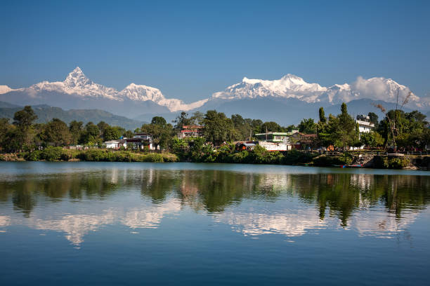 istock View at Annapurna mountain range and its reflection in Phewa lake in Pokhara, Nepal 848679342