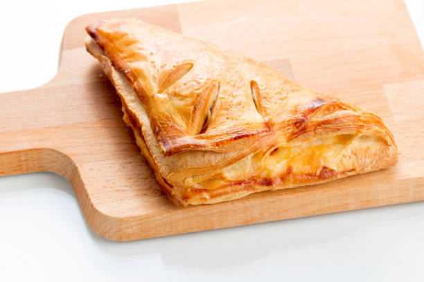 Puff pastry pies with with honey, berries and nuts . Puff pastry pies with with honey, berries and nuts . on white background. on wooden plate mark goodson screening room stock pictures, royalty-free photos & images