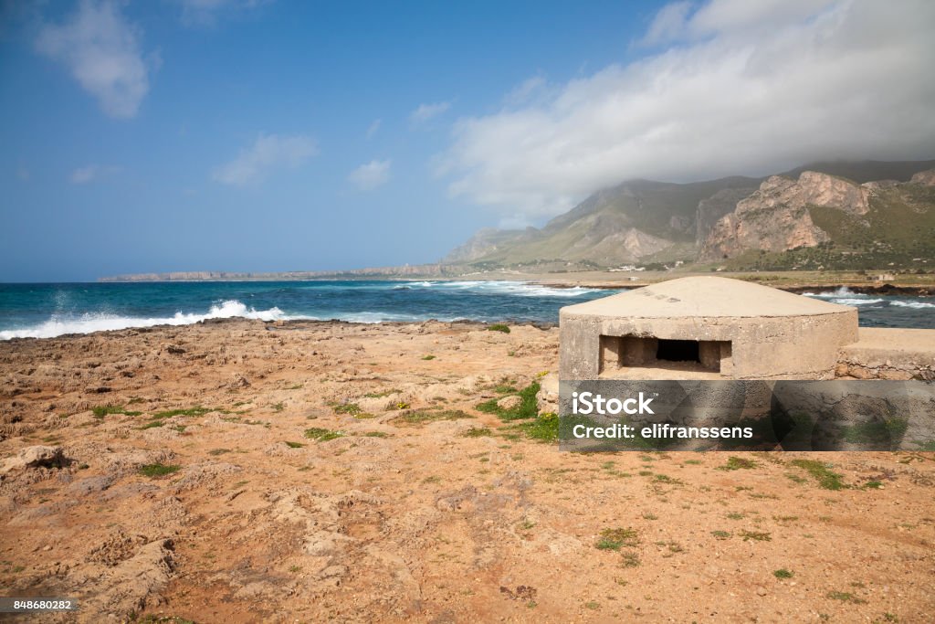 Bunker, Sicily An old remnant of a bunker of the war WWII on the coast of Sicily in the Gulf of Macari near San Vito lo Capo in the Trapani province Beach Stock Photo