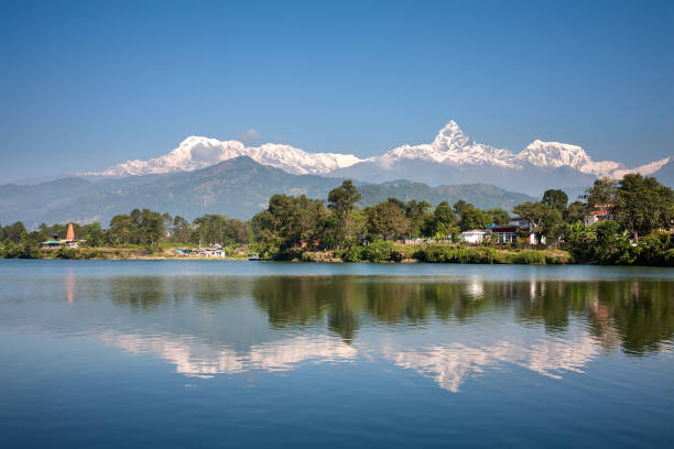 istock View at Annapurna mountain range and its reflection in Phewa lake in Pokhara, Nepal 848682704