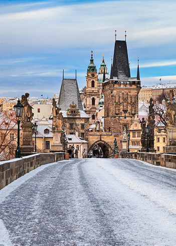 Empty snow covered Charles Bridge at winter, Prague