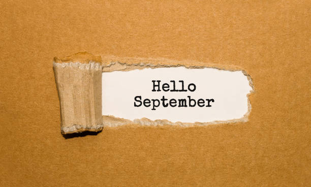 istock The text Hello September appearing behind torn brown paper 848692372