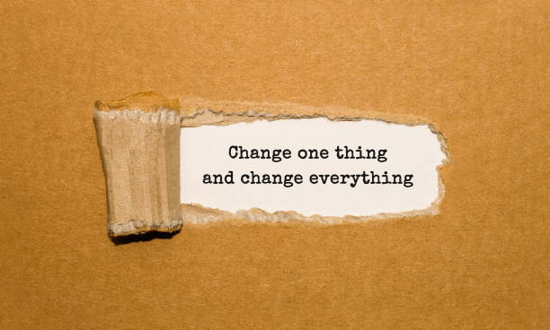 istock The text Change one thing and change everything appearing behind torn brown paper 848701530
