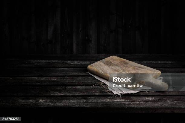 Dark Wooden Table For Product Old Black Wooden Perspective Interior With Old Cutting Board Stock Photo - Download Image Now