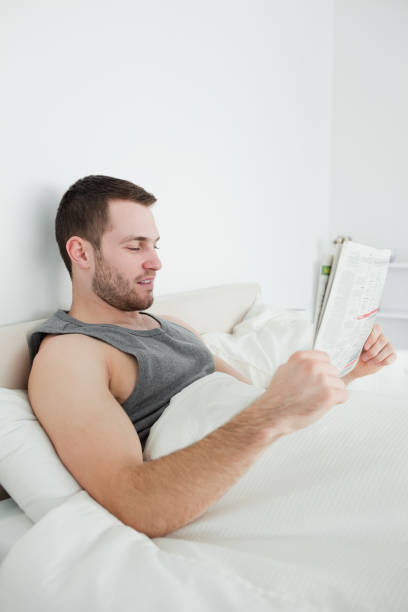 istock Portrait of a focused man reading a newspaper 848708374