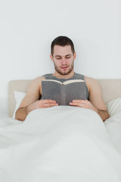 istock Portrait of a man reading a novel 848708880