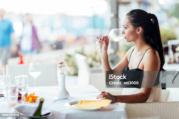 Woman Tasting White Wine In Restaurant Stock Photo - Download Image Now - Adult, Adults Only, Alcohol - Drink