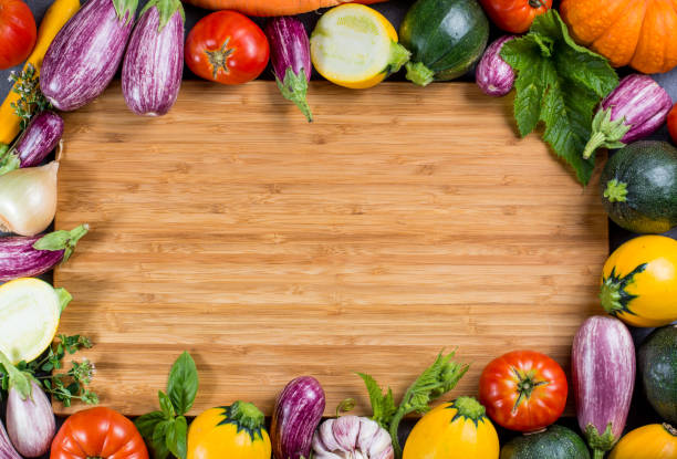 istock Bamboe plate with copy space, restautant concept with fresh organic vegetables - round courgette, small eggplants, tomatoes, diet concept, healthy food. Menu template. 848716872