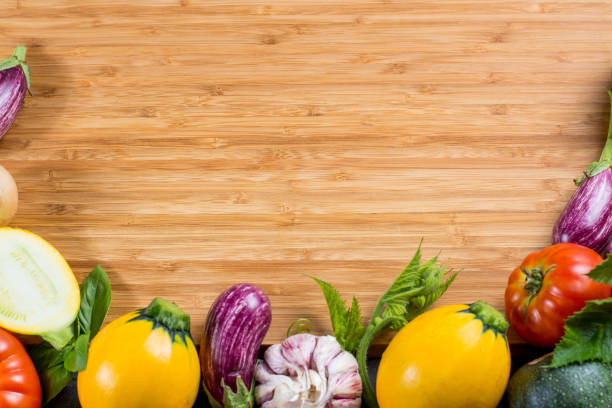 istock Bamboe plate with copy space, restautant concept with fresh organic vegetables - round courgette, small eggplants, tomatoes, diet concept, healthy food. Menu template. 848716886