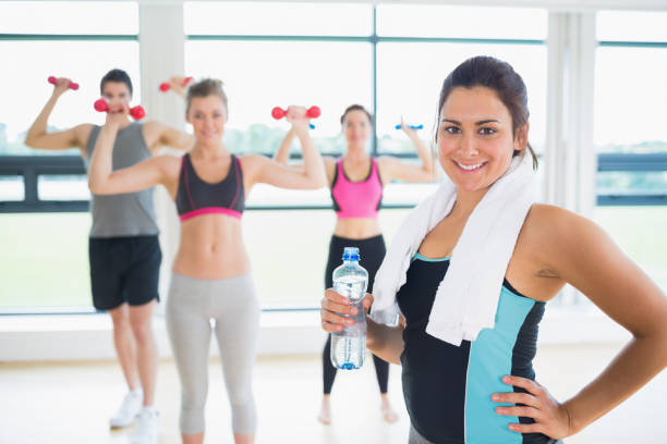 istock Woman at front of aerobics class 848717058