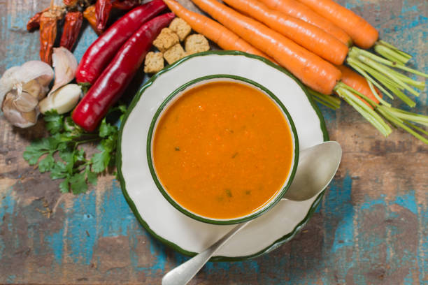 Spicy carrot soup with harissa made from hot chili pepper, lemon, garlic, coriander.