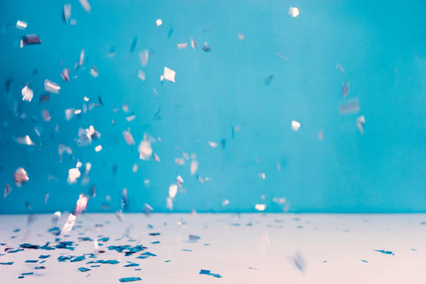 Blue confetti background. Flat lay style. Festive concept