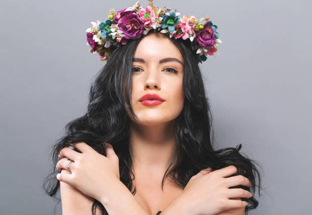 istock Beautiful young woman with a garland 848721018