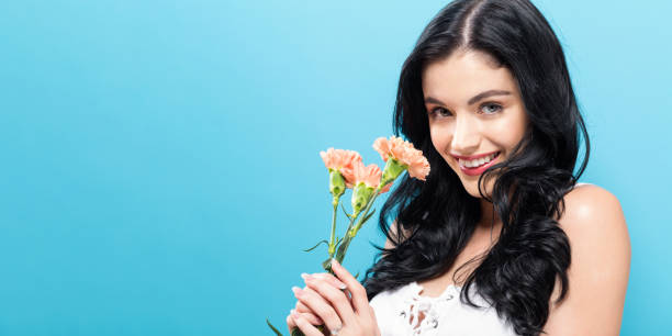 istock Young woman with carnation 848721086