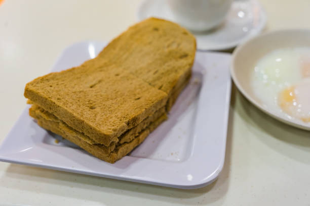 istock Singapore Breakfast Kaya Toast, Coffee bread and Half boiled eggs 848727050