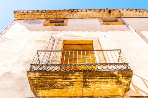 Stylish balcony with a metal railing, solid architectural element, a place of rest and relaxation, vintage decor, balcony