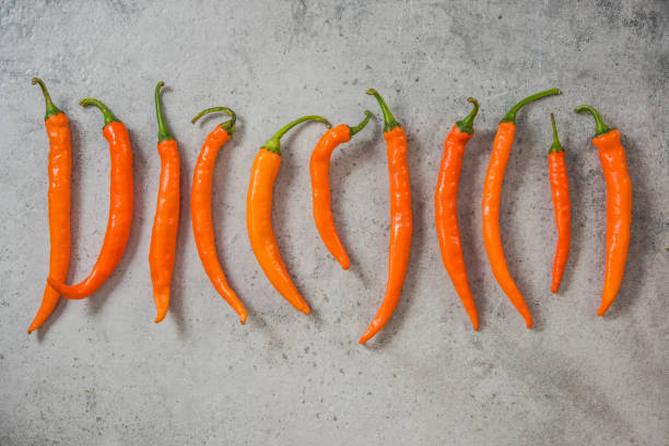 istock Orange peppers on stone slate 848744740