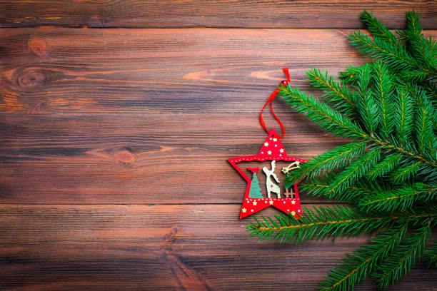 istock Christmas tree branch with a toy on a wooden background 848744994