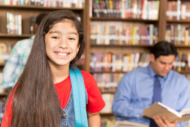 istock Latin descent girl in school library. 848745052