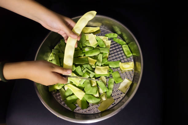 Green bean on hands
