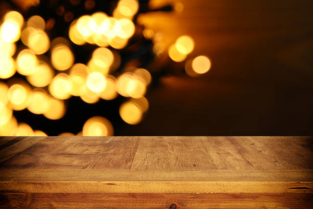 istock Empty table in front of black and gold glitter lights background 848758986